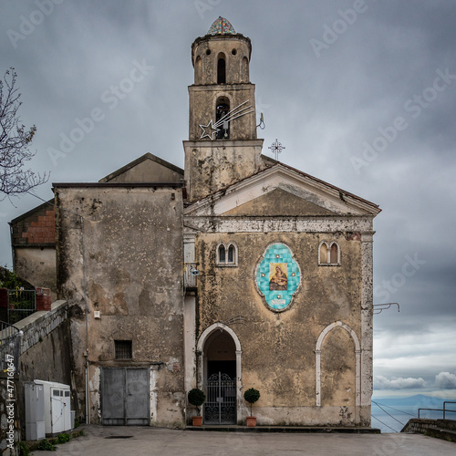 San Michele chapel with tiled Virgin Mary decoration Furore, Agerola, Amalfi coast, Italy, under gray cloudy sky