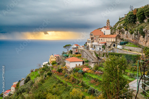 Amalfi coast near Furore, San Michele, Amalfi Coast, Italy, with Tyrrhenian Sea and sunset behind gray clouds photo