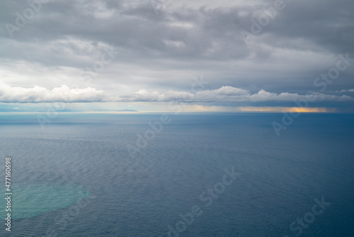 Ocean, sunset, and gray storm clouds offshore, Tyrrhenian Sea, Amalfi Coast, Italy