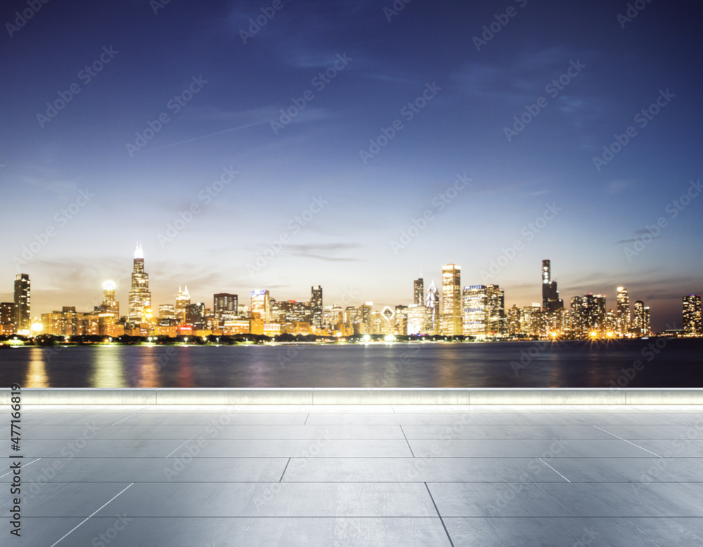 Empty concrete seafront on the background of a beautiful blurry Chicago city skyline at evening, mock up