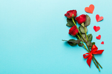 Valentine day composition with rose flower and red heart on table. Top view, flat lay, copy space Holiday concept