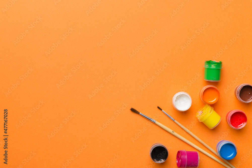 art palette with paint and brushes, close up. Top view with empty space. workplace for creativity. home teaching concept drawing art palette with paint and brushes, close up. Top view with empty space. workplace for creativity. home teaching concept drawing