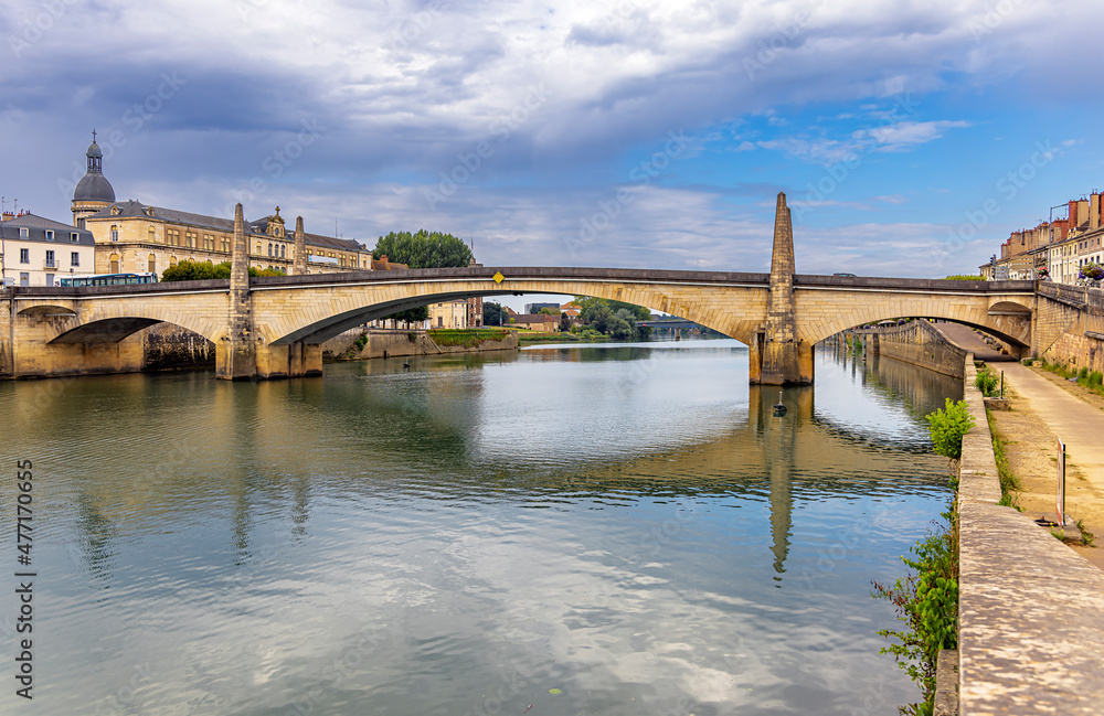 Chalon-sur-Saone, France, beautiful stone arch bridge over the Saone river in Saint-Remy, in cloudy day