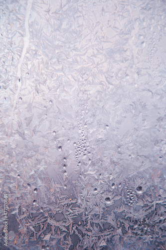 Winter frost on the window glass  ice purple pattern