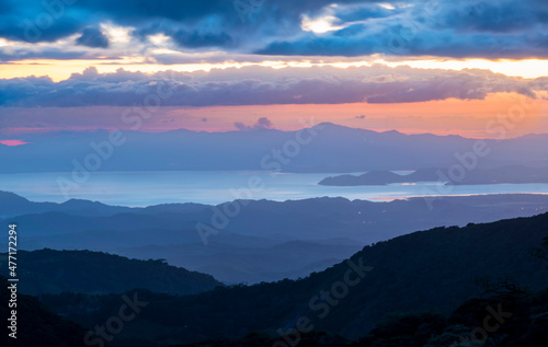 Panoramic view in beautiful orange sunset. Santa Elena in Costa Rica highlands, Monteverde