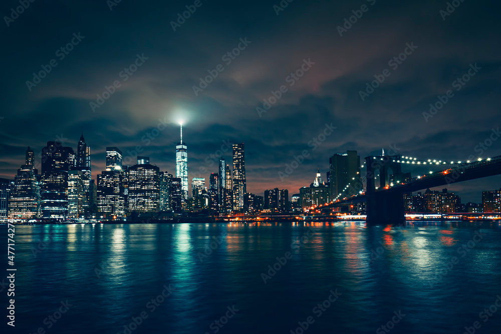 View of New York with Brooklyn bridge by night