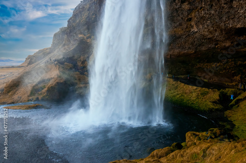 Seljalandsfoss waterfall on the Seljalands river, streams of water falling from a height of 60 meters, Iceland photo