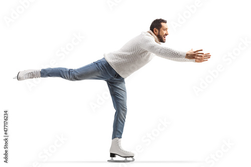 Man in jeans and white knitwear practicing ice skating