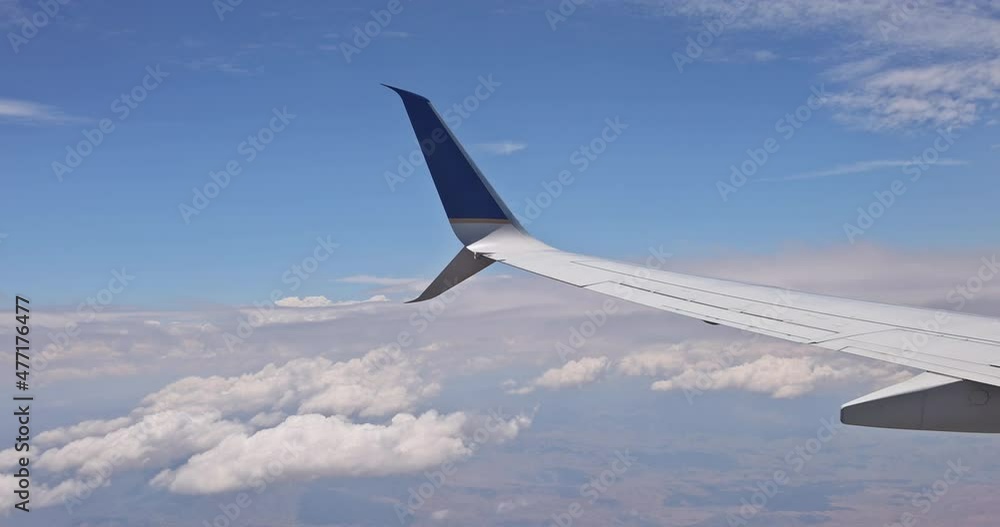 View from the plane window overlooking the clouds the structure white cloud View from the plane window overlooking the clouds the structure white cloud