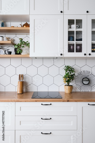 White wood kitchen furniture in modern apartment © brizmaker