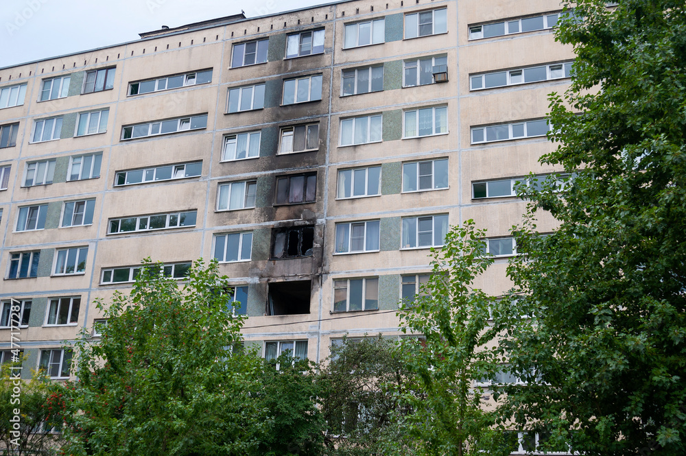 Windows of an multi-storey residential building after a fire