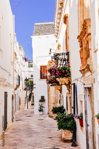 Narrow white streets of Locorotondo in Puglia (Apulia) region, southern Italy photo