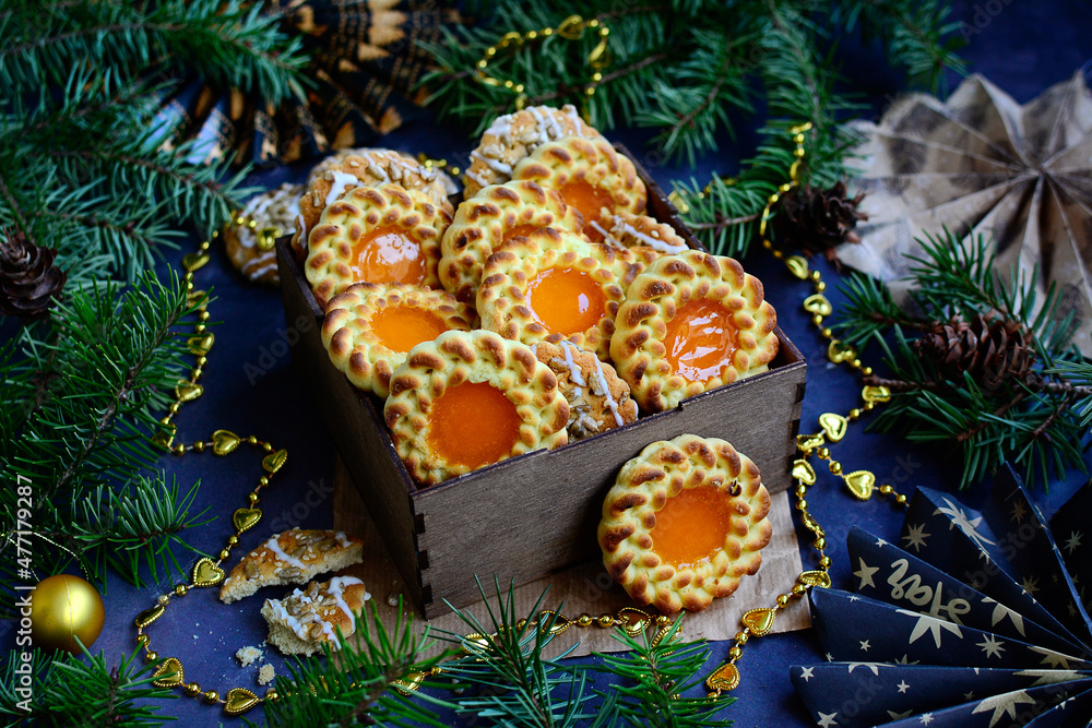 Christmas cookies with festive decor on the background of fir branches. New Year's gift concept Christmas cookies with festive decor on the background of fir branches. New Year's gift concept