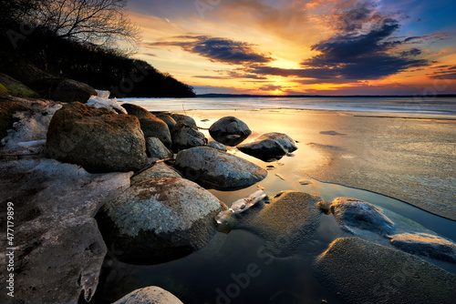 Ice taking hold on the rocks of Lake Mendota in Madison, WI.