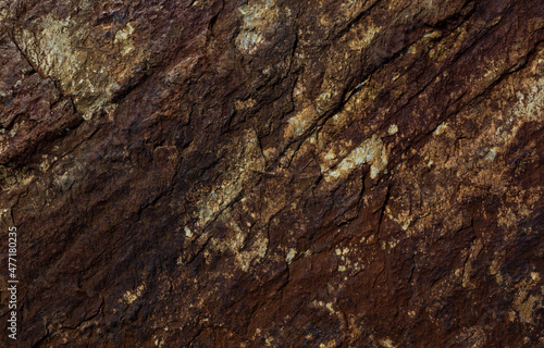 Old rusty granite rock with lots of cracks, grungy background.