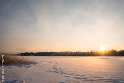 Winter landscape with sunrise. The path in the snow.