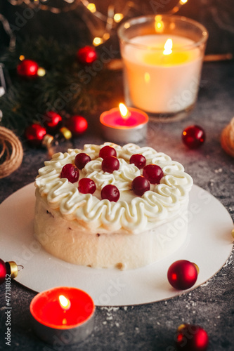 Christmas cake. Delicious cake with winter decor. Lingonberry cake on the table 