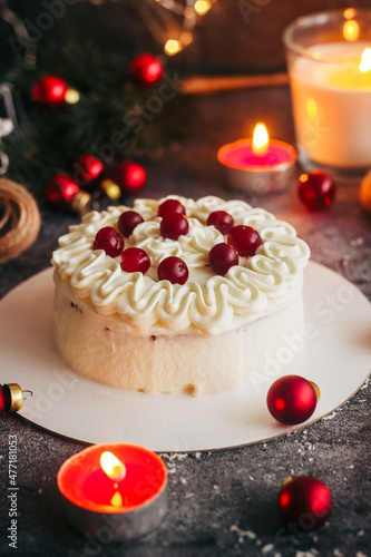 Christmas cake. Delicious cake with winter decor. Lingonberry cake on the table 