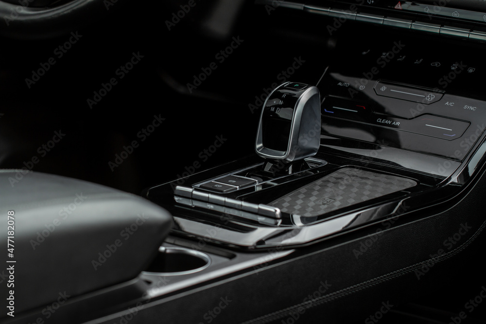Modern automatic gearbox. Close up of the gearbox transmission handle. Automatic gear stick. Modern automatic gearbox. Close up of the gearbox transmission handle. Automatic gear stick.