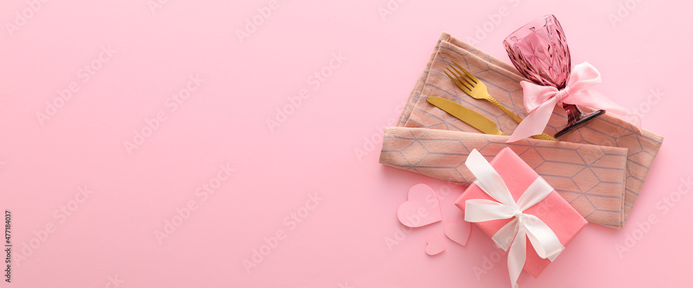 Beautiful table setting for Valentine's Day on pink background with space for text