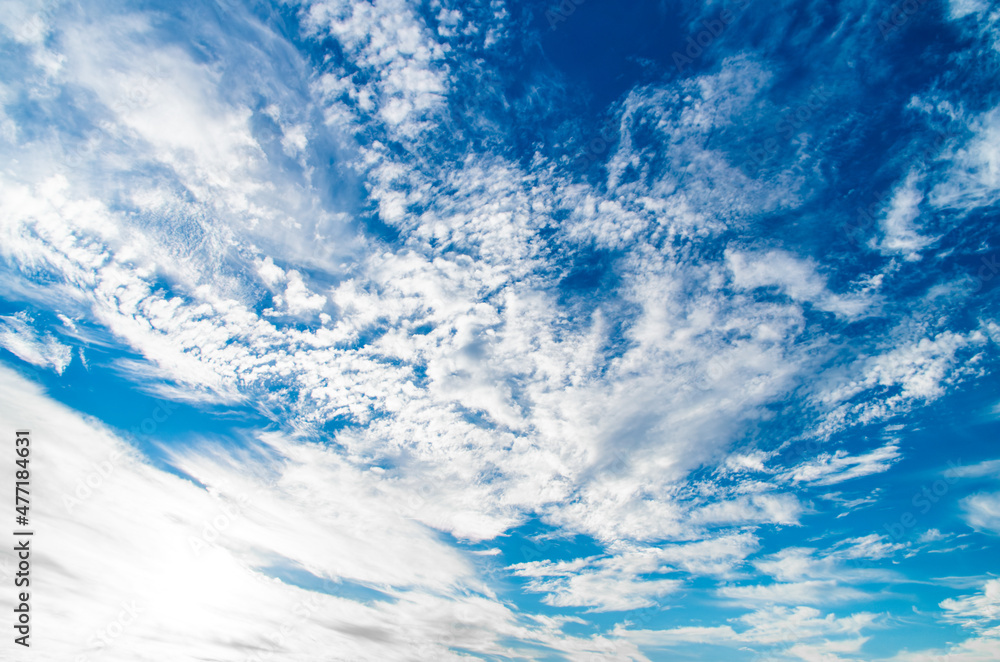 blue sky with white clouds and sun on a wide-angle lens Stock Photo