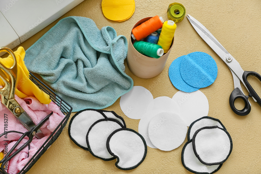 Materials for making reusable cotton pads on beige background Materials for making reusable cotton pads on beige background