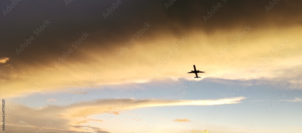 plane and sunset