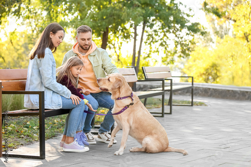 Happy family with funny Lab...