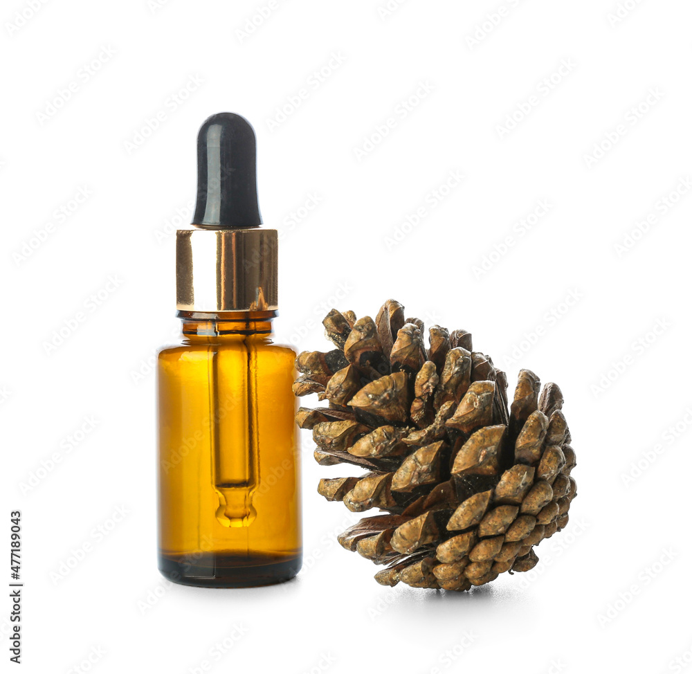 Bottle of essential oil and pine cone isolated on white background Bottle of essential oil and pine cone isolated on white background