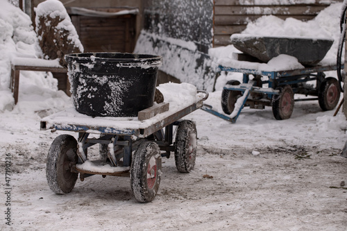 two industrial carts in stone workshop in winter