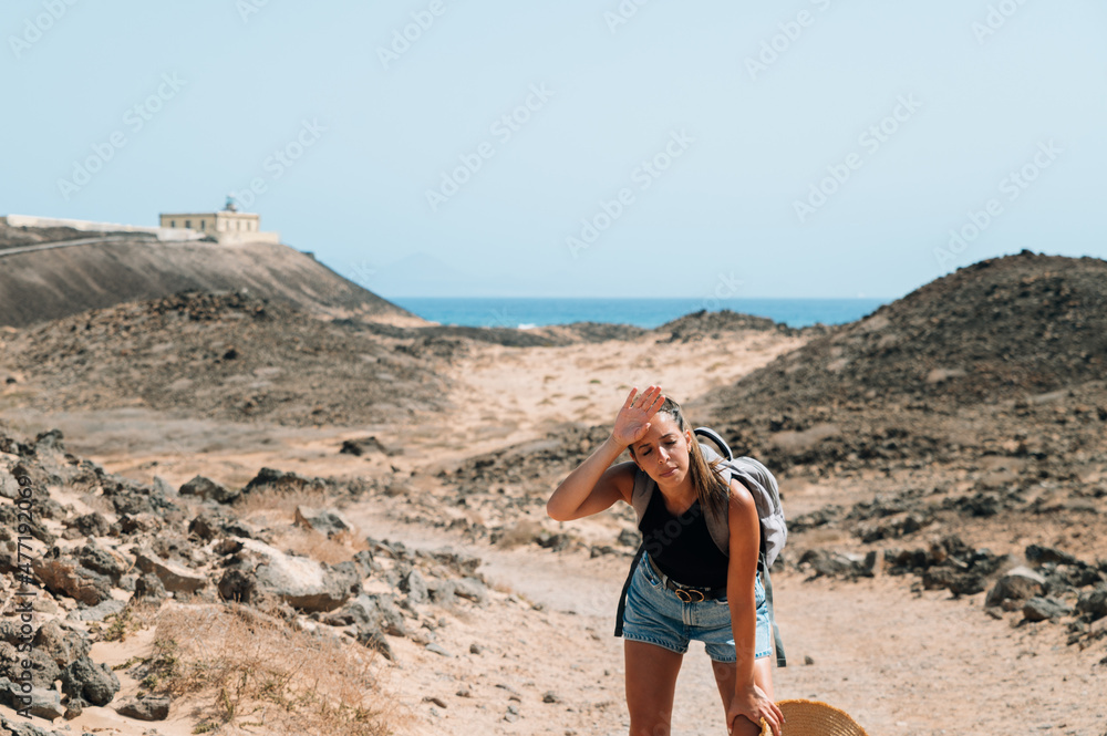 Female traveler taking break during trekking