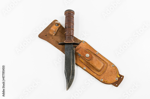 Fotografie Antique hunting knife with leather sheath and sharpening stone.