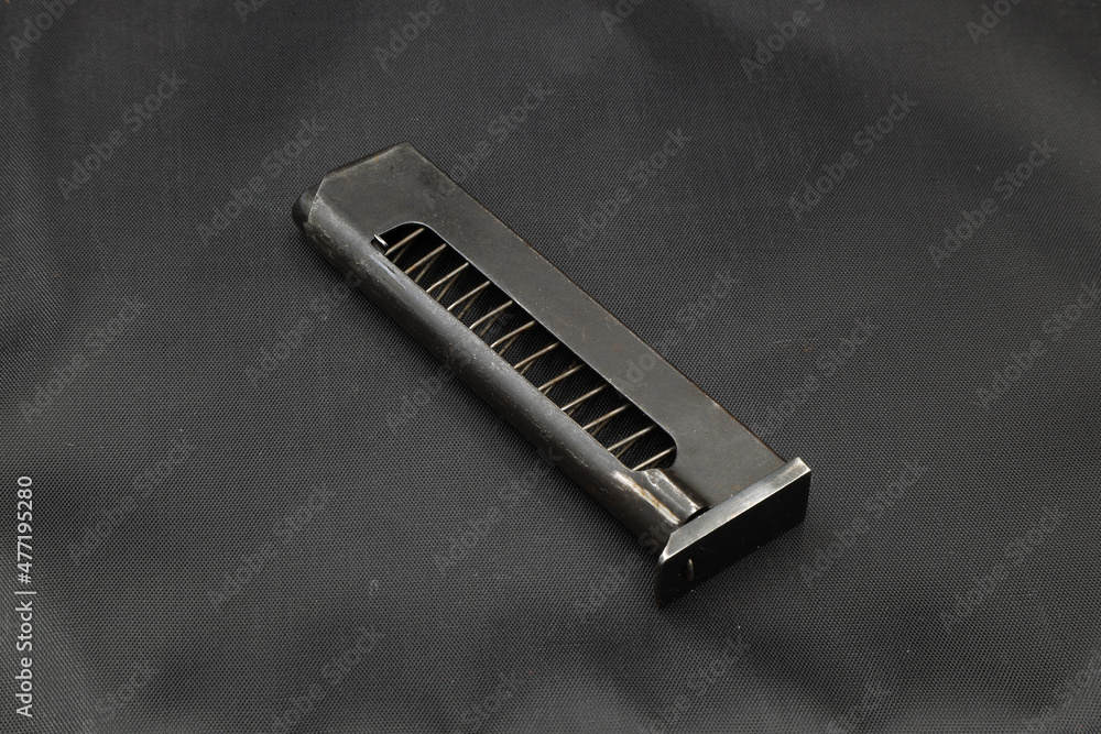 pistol magazines on a black background pistol magazines on a black background