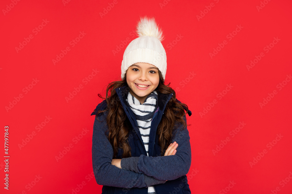 teen girl on red background. portrait of child wearing warm clothes. express positive emotion. teen girl on red background. portrait of child wearing warm clothes. express positive emotion.