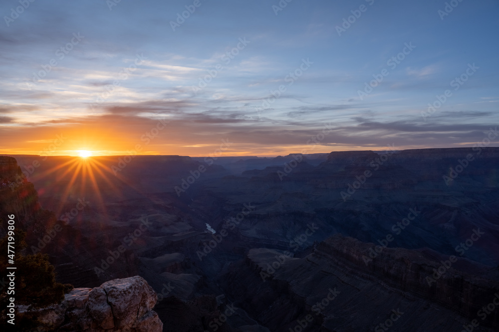 Purple Sunset with Orange Sunburst over the Grand Canyon