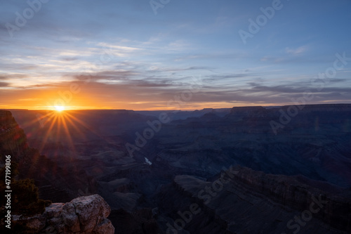 Purple Sunset with Orange Sunburst over the Grand Canyon © kellyvandellen