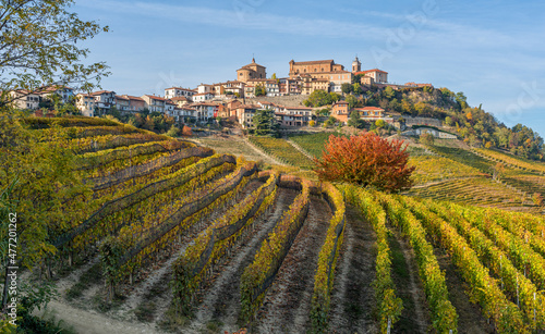 Beautiful hills and vineyards during fall season surrounding La Morra village. In the Langhe region, Cuneo, Piedmont, Italy. photo