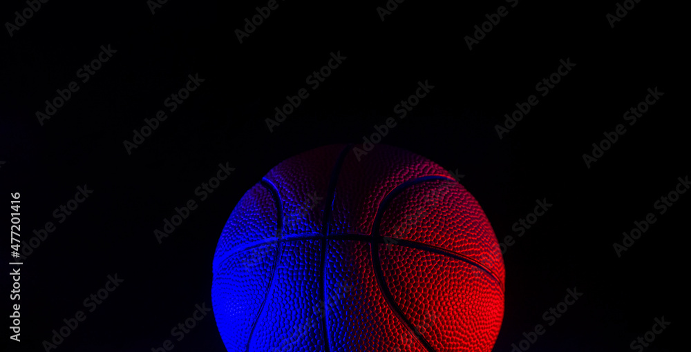 Fototapeta premium Basketball ball isolated on dark background. Blue neon banner. Horizontal sport theme poster, greeting cards, headers, website and app
