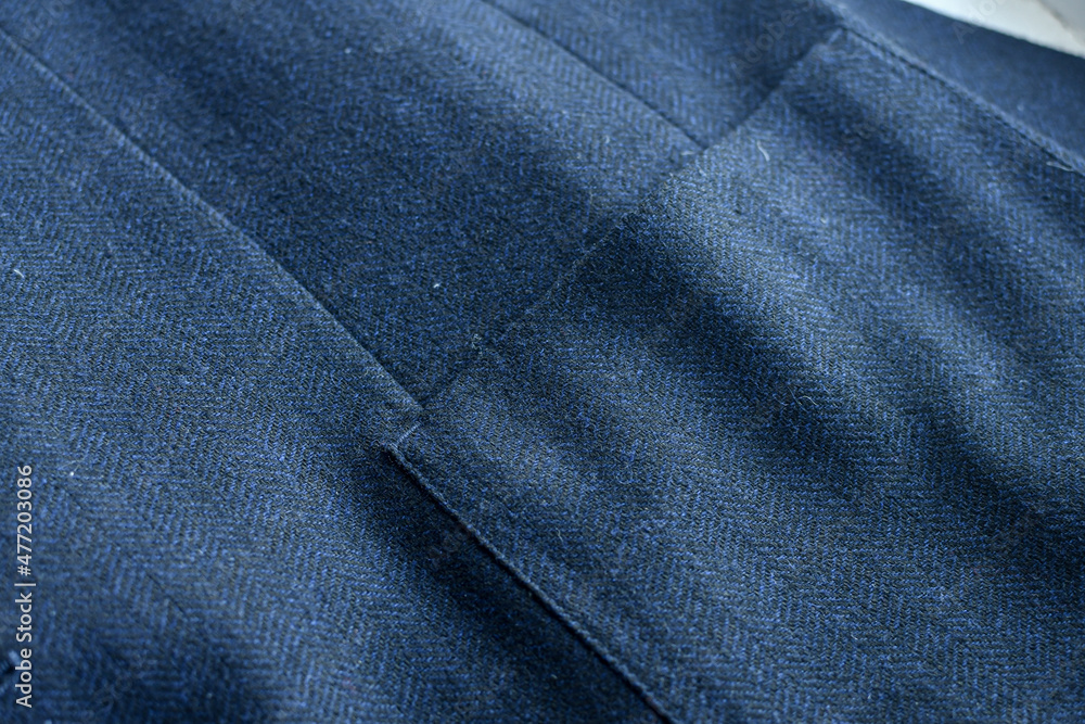 Detail of men casual outwear, blue woolen blazer, with a pocket fragment.