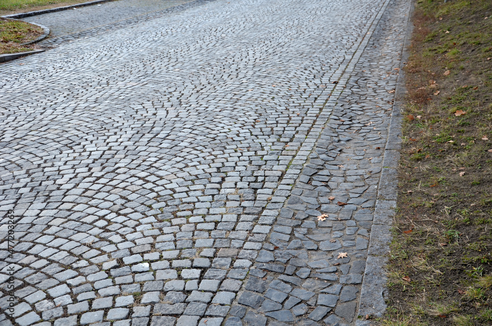 drainage of a cobbled road to the side. cobble gutter drained into a ...
