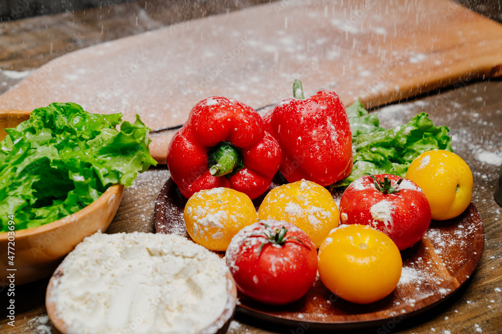 flour and floured vegetables on kitchen table. dirty work surface while cooking
