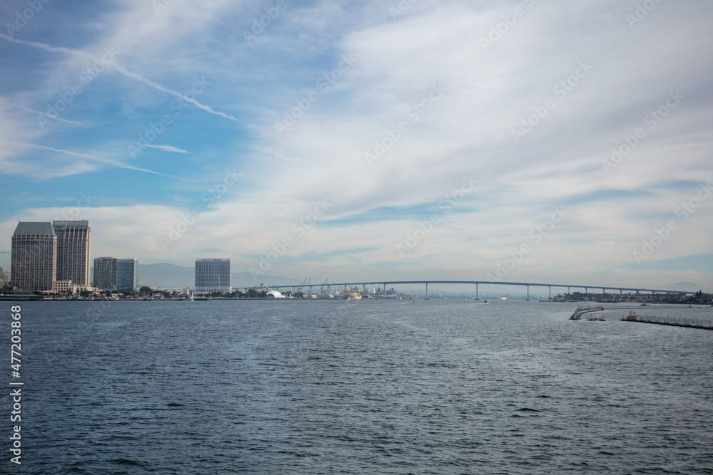 A View of the San Diego Downtown Area from a Boat on Coronado Bay with the Coronado Bridge in the Background A View of the San Diego Downtown Area from a Boat on Coronado Bay with the Coronado Bridge in the Background