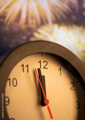 Canvas Print clock at midnight and fireworks  New Year's eve celebration