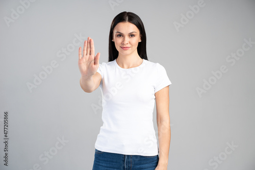 Wallpaper Mural Young woman with bad attitude making stop gesture with her palm outward, saying no, expressing denial or restriction. Negative human emotions, feelings, body language concept Torontodigital.ca