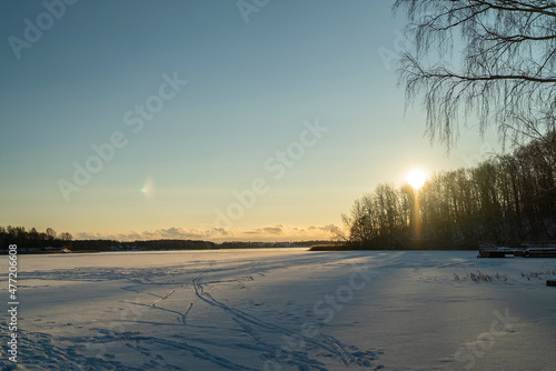 winter landscape ice-covered lake in the setting sun