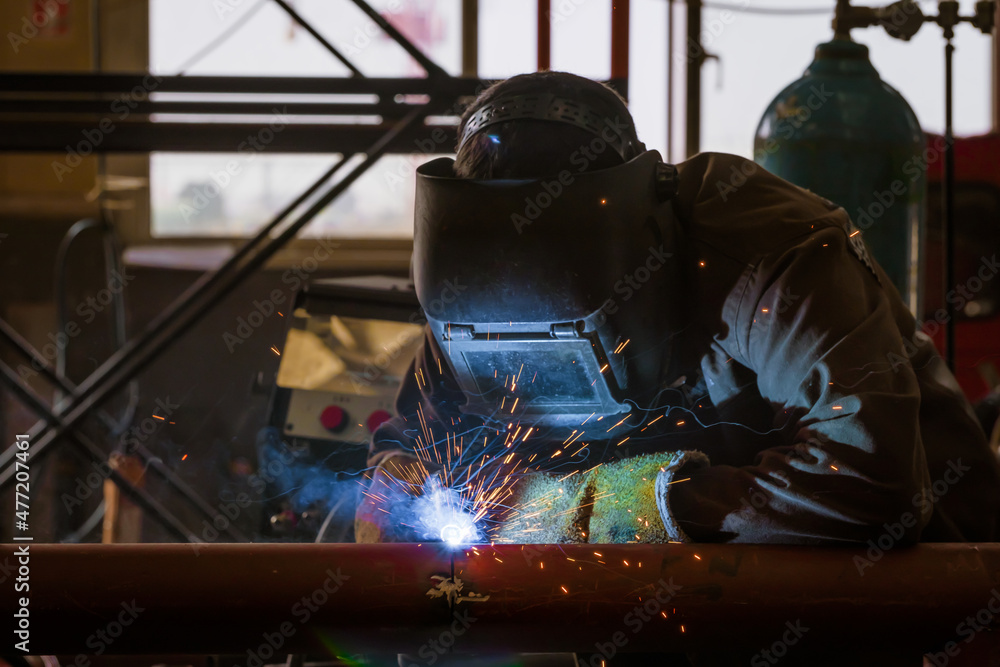 Welding of metal structures by semi-automatic arc welding. MIG welding. Welding of metal structures by semi-automatic arc welding. MIG welding.
