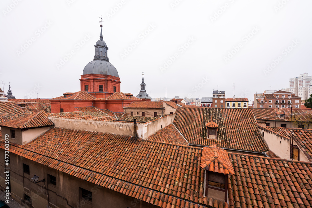 typical rooftops of the city of Madrid with church and skyline