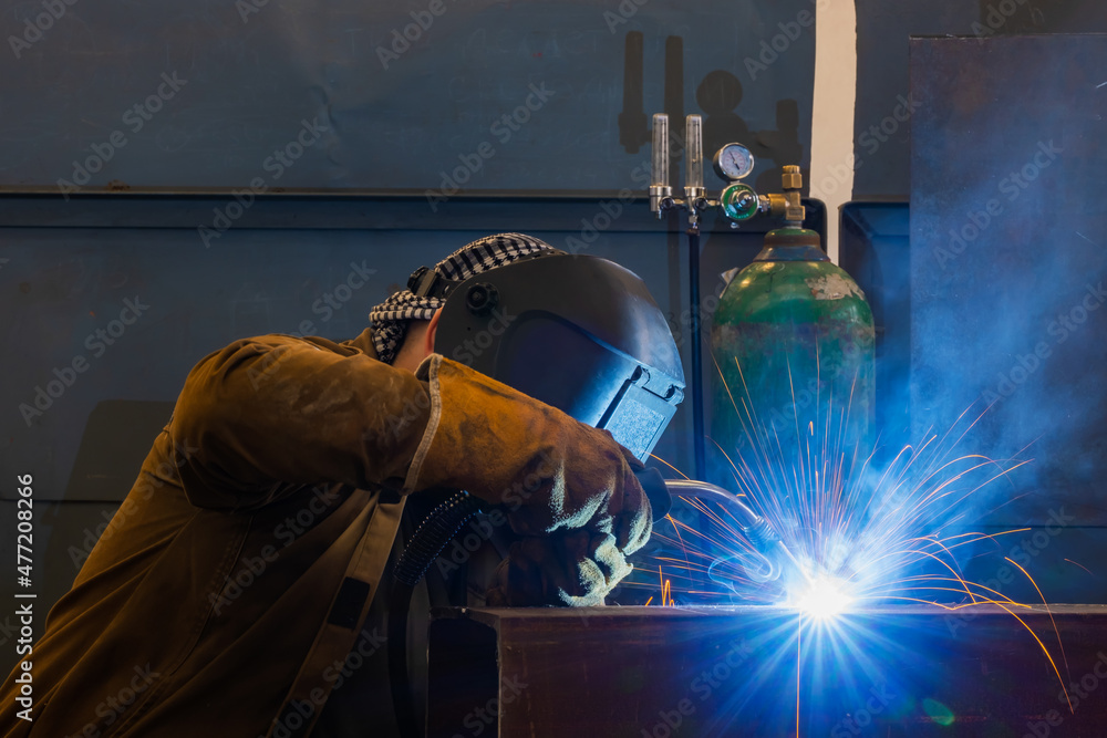 Welding of metal structures by semi-automatic arc welding. MIG welding. Welding of metal structures by semi-automatic arc welding. MIG welding.