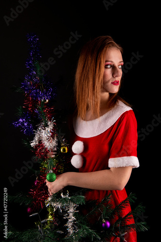 Young woman wearing santa claus costume