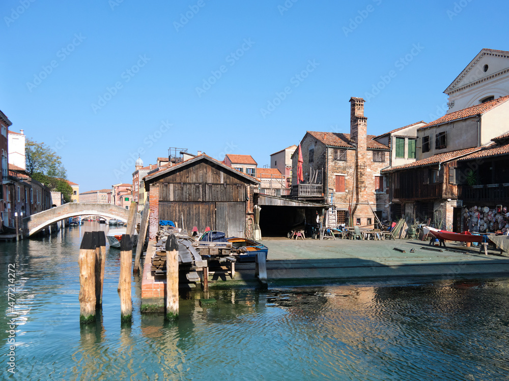 Romantic Venice, Squero di San Trovaso, famous boatyard in Venice. Landmark boat yard for building and repair of traditional wooden gondolas. Romantic Venice, Squero di San Trovaso, famous boatyard in Venice. Landmark boat yard for building and repair of traditional wooden gondolas.
